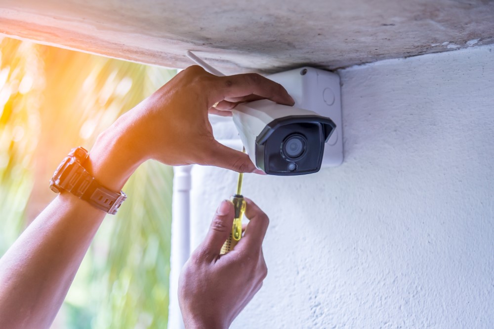 Technician Installing IP Wireless Cctv Camera By Screwed For Home Security System And Installed
