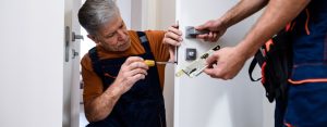 Image of a man setting up a Door Locks & Padlocks